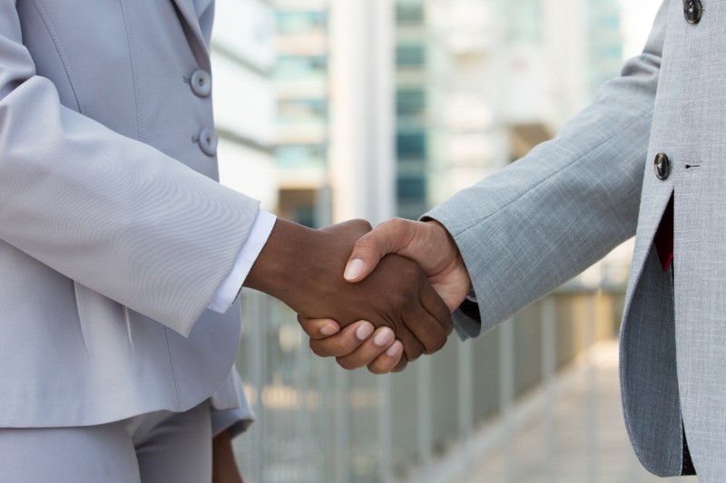 multiethnic-leaders-greeting-each-other-city (1) (1)